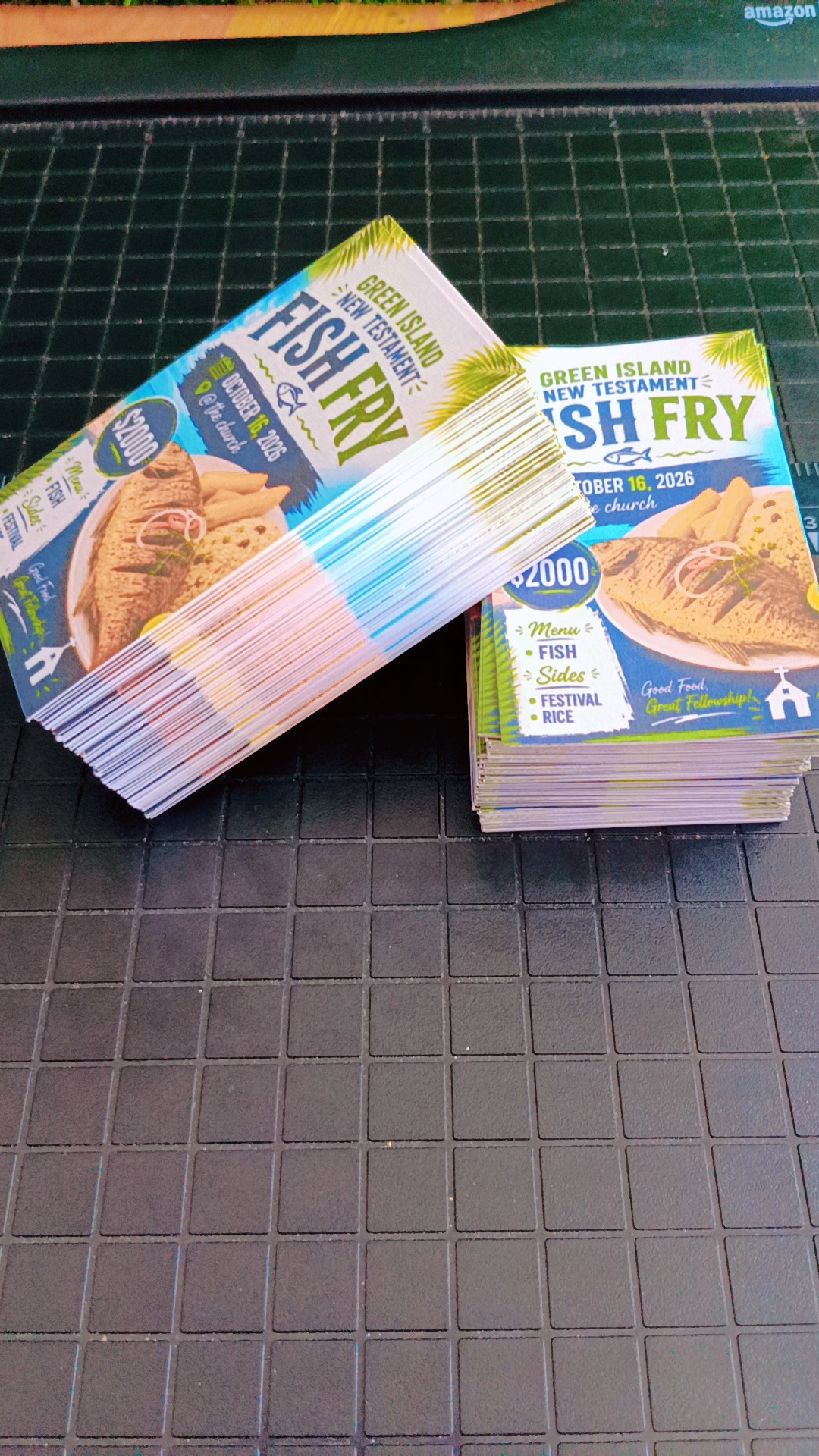 Stacks of fish fry event tickets
